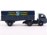 a toy truck that is sitting on a white surface
