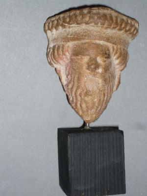 a statue of a man with a hat on it ' s head