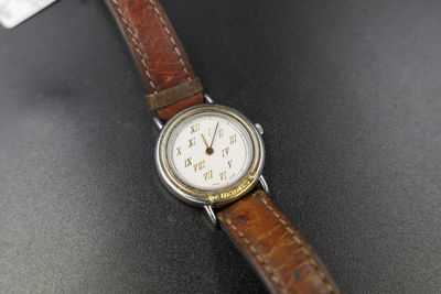 a close up of a wrist watch on a table