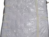 the mattress is wrapped in plastic and ready to be shipped