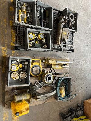 a wall of tools on the wall of a garage