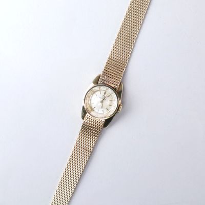 an image of a wrist watch on a white surface with a white background