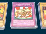 three cards are sitting on a table with a blue background