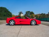 a red sports car parked on the side of the road