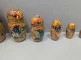 five nesting dolls that are lined up in a row