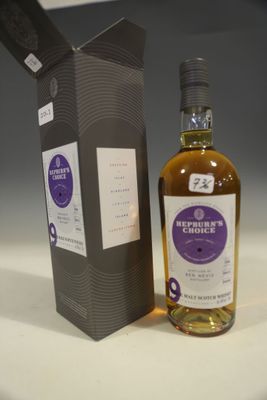 an image of a bottle of whisky sitting next to a box