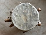 an overhead view of a wooden table with a white cloth on top