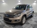 the volkswagen tiguan is parked on a checkered tile floor