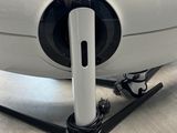 an image of a small white airplane on a stand