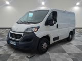 the white van is parked on a checkered floor in a room