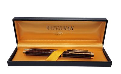 a close up of a pen in a box on a white background