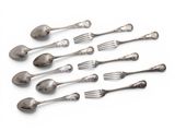 a lot of silver spoons and forks on a white surface