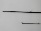 a close up of two fishing rods on a white surface