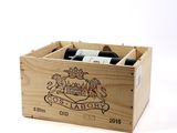 a wooden box with two bottles of wine in it