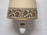 a lamp that is sitting on a table next to a wall