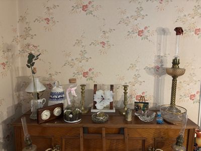 a dresser with a bunch of items on top of it