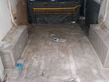 the back of a van with the door open and the seats folded down