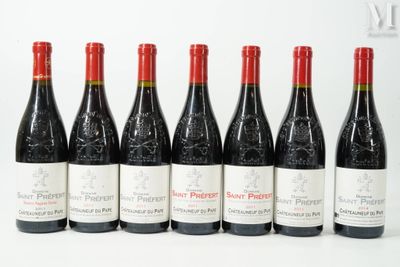 six bottles of wine lined up in a row on a white surface