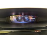the dashboard of a car with a digital display in the center