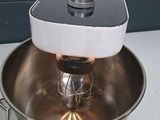 a mixer that is sitting on a counter next to a blender
