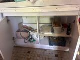 an image of a kitchen with a sink under the counter