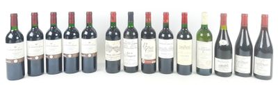 six bottles of wine are lined up in a row on a white surface