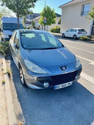 a car parked on the side of the road next to a curb