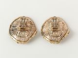 a pair of gold earrings with a crown on top of them