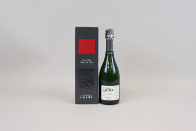a bottle of wine sitting next to a box of wine