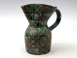 a green vase with a spiral design on it