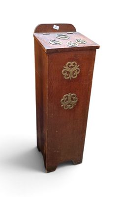 a small wooden cabinet with three drawers and a clock on it