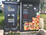 two vending machines that are on the side of the road