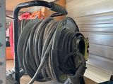 a hose that is attached to the side of a garage door