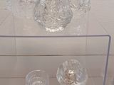 a glass display case with a bowl and a bowl on it