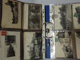 a bunch of old books that are open on a table