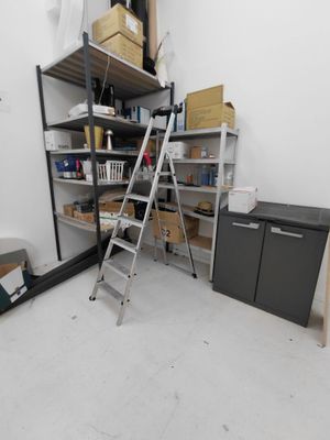 a ladder that is leaning against a wall in a room