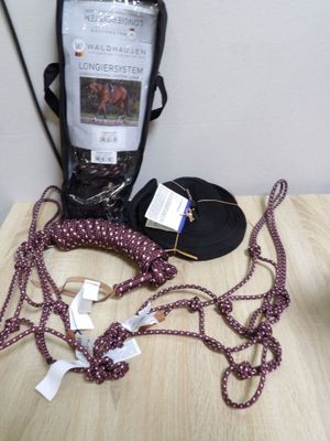 a table with a cell phone, a cell phone, and other items on it