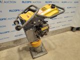 an image of a small machine that is sitting on a stand