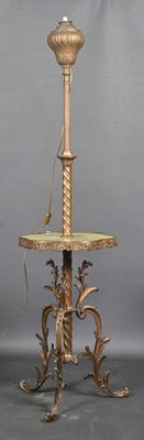 a lamp that is sitting on a stand on the floor