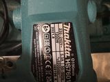 a blue machine that is sitting on top of a table