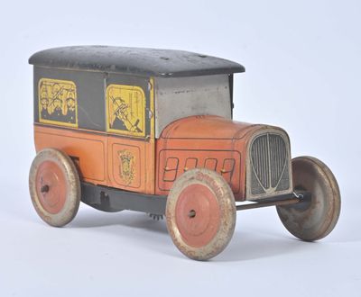 a small toy truck with a black top and red wheels