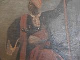 un tableau représentant un homme assis sur une chaise, tenant une épée