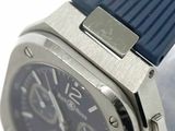 a close up of a watch with a blue strap on it