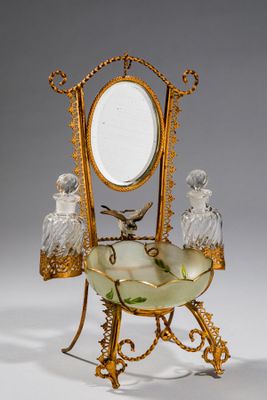 a gold and glass vanity with a mirror on top of it