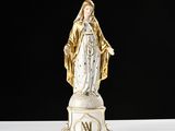 an image of a statue of the virgin mary of guadalupe on a pedestal