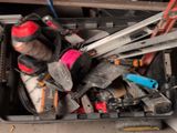 a box full of tools that are sitting on the floor