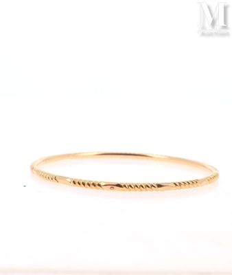 a close up of a gold ring with a small inscription on it