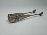 pair of antique silverware spoons on a white surface