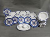 a lot of blue and white plates and cups and saucers