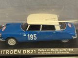 a blue car with a white roof in a clear case